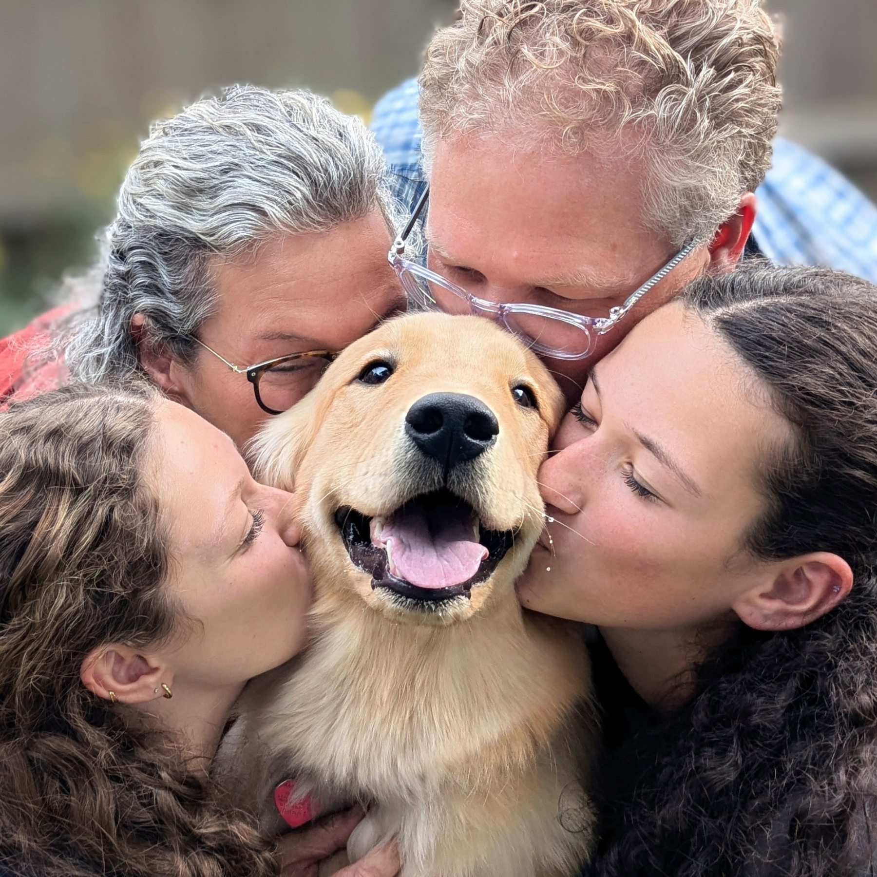 familing kissing dog